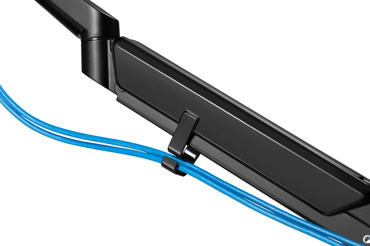 Close-up of the LCD monitor arm cable channel with a blue cable routed through