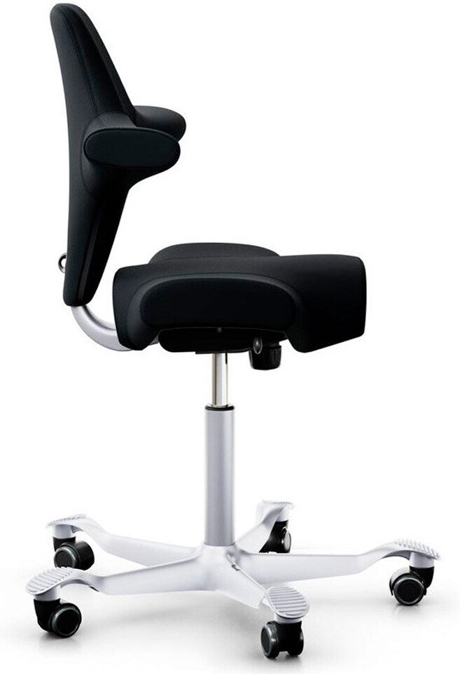 Capisco chair with long gas spring viewed from the side, showing the saddle seat