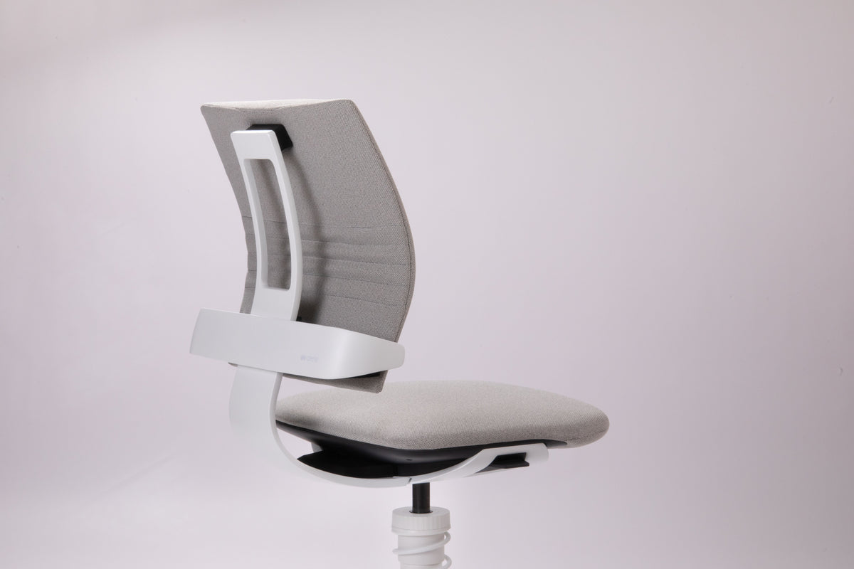 3Dee active chair with white frame and grey upholstery viewed from the side