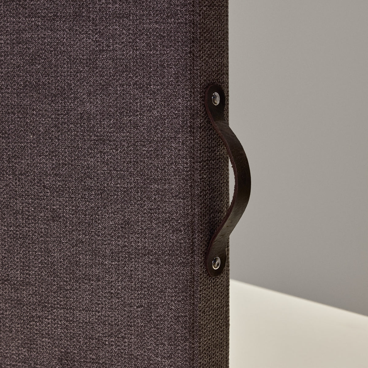 Close-up of the grey fabric and carry handle on the Easy School desk screen