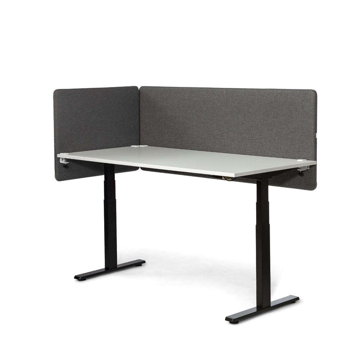 White desk with grey MUTE acoustic screens on two sides, viewed at an angle