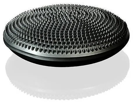 Grey flex balance cushion with a textured surface, shown at an angle