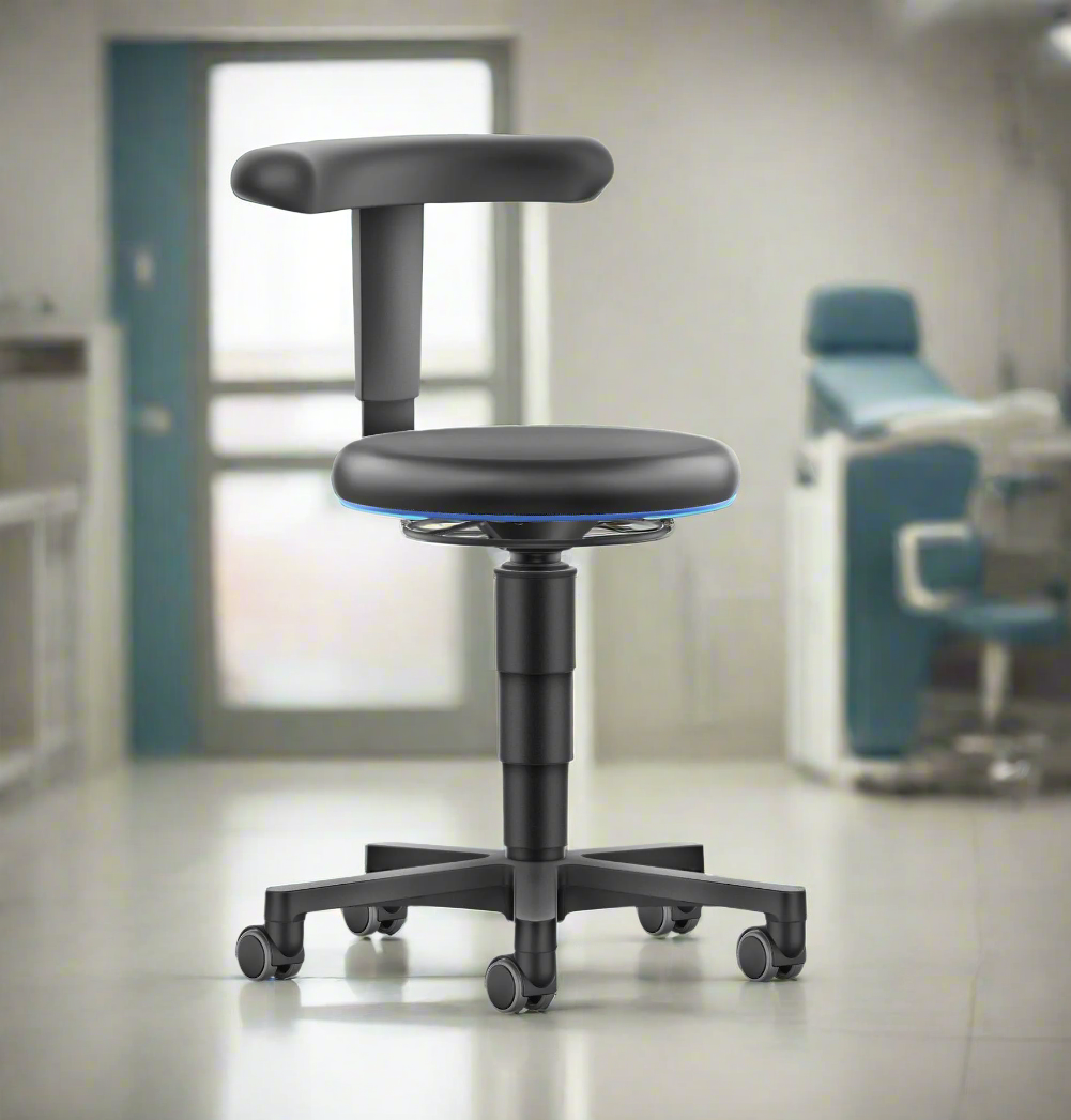 Cleanergo stool in a medical treatment room beside a workstation