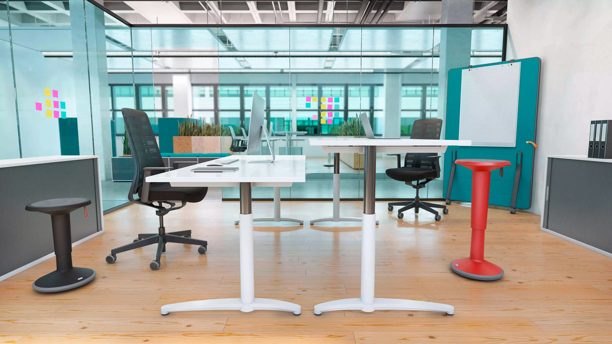 Office with round tables and UPis1 active chairs beside a window
