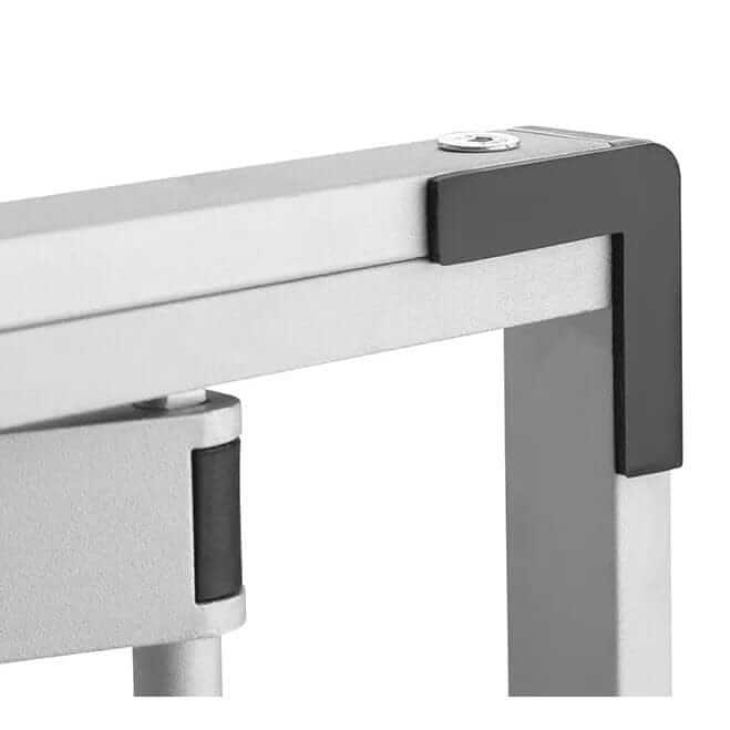 Close-up of the white frame edge and table clamp on the GetUpDesk Free