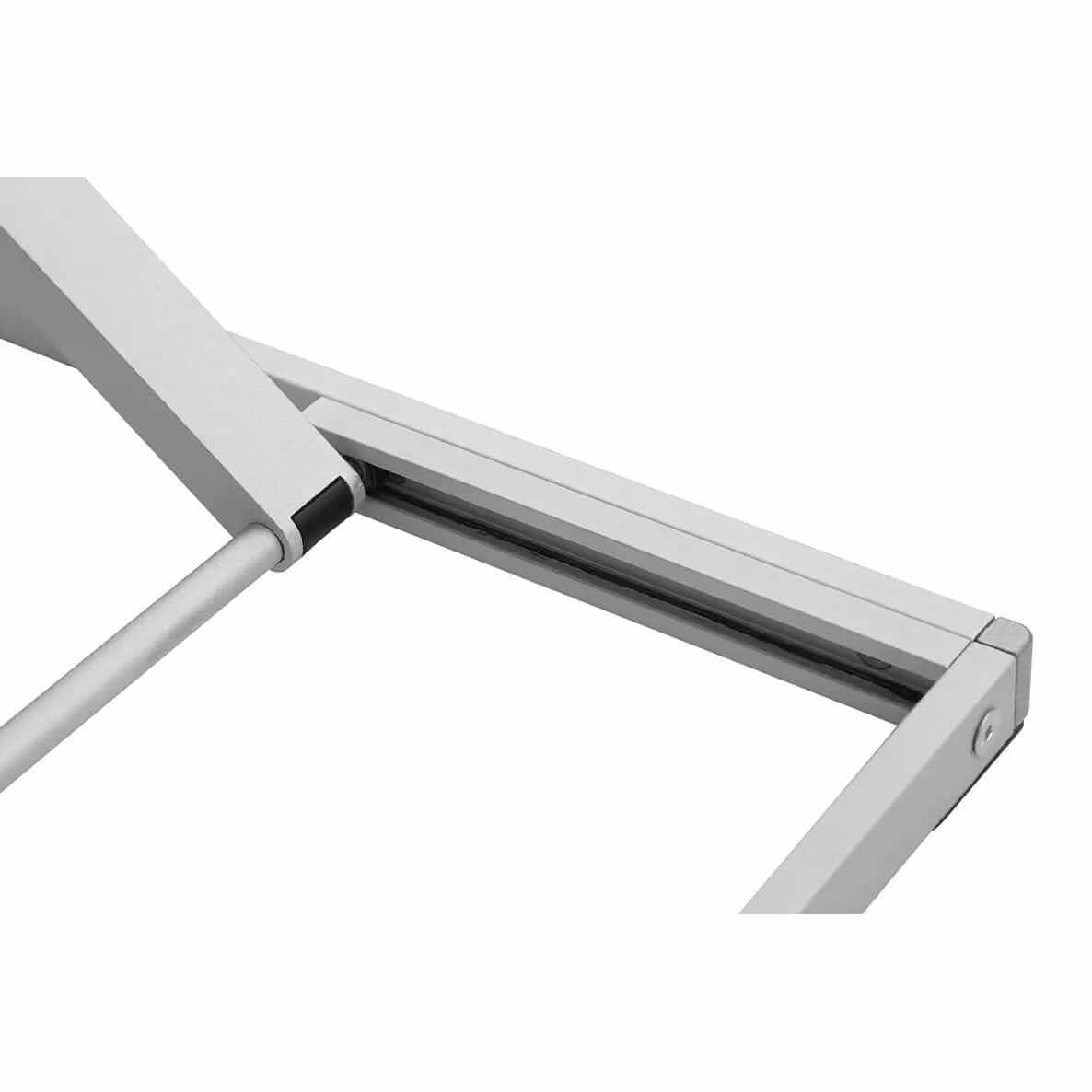 Close-up of the scissor lift mechanism under the GetUpDesk Free tabletop