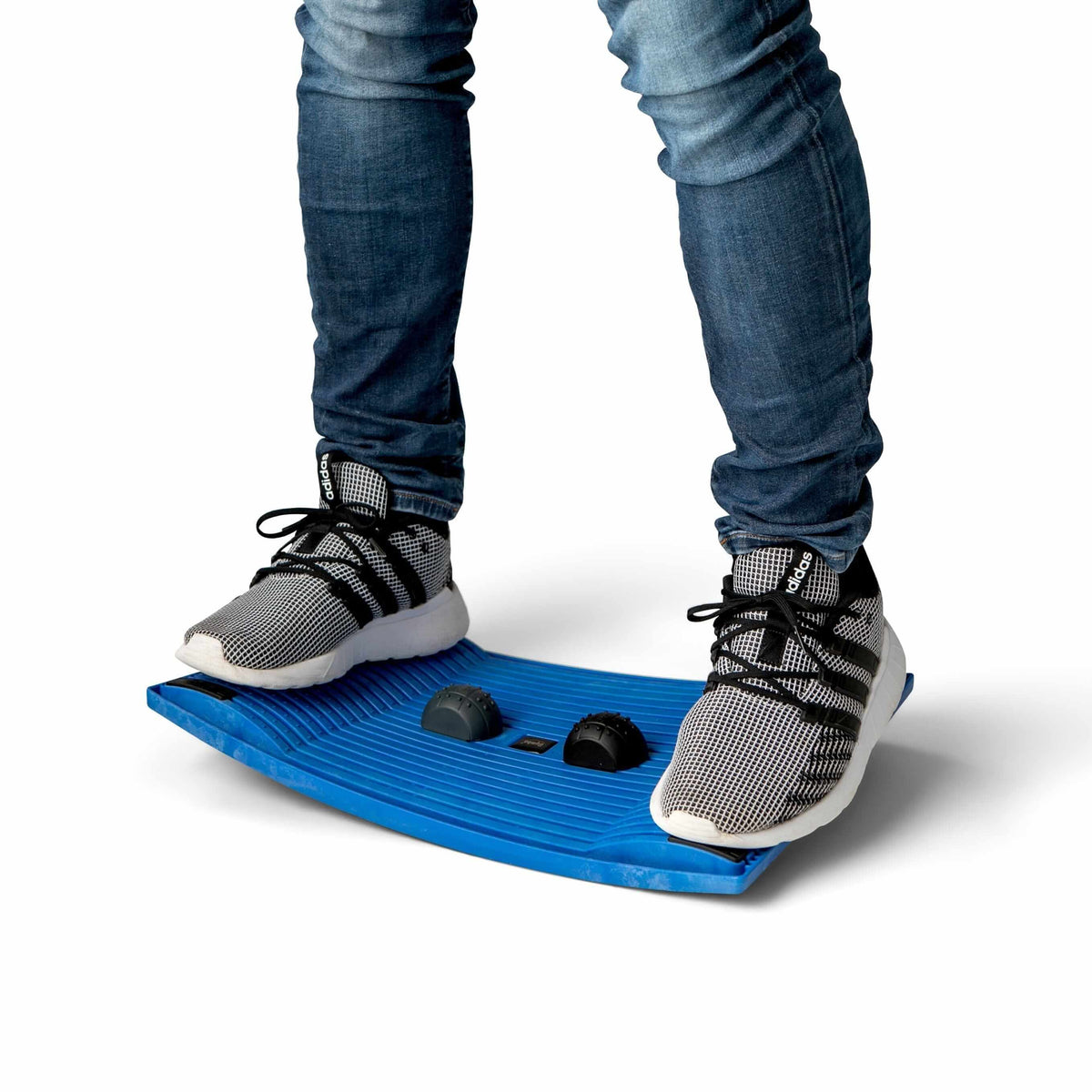 Person standing on a blue Gymba activation board, encouraging movement and fitness at work.
