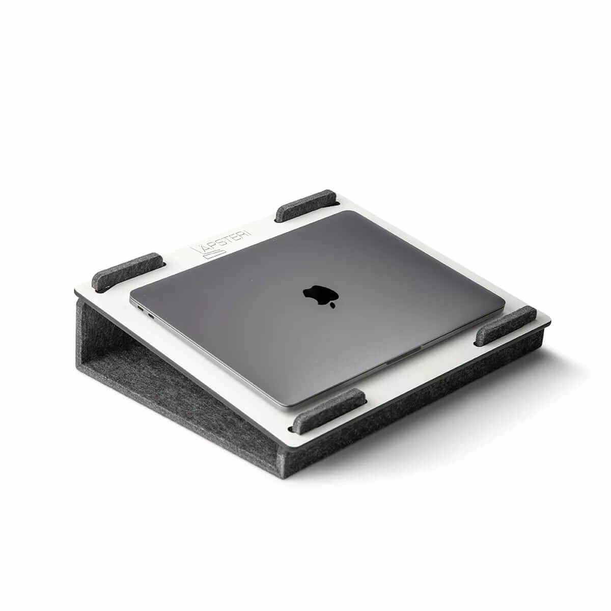 Lapsteri laptop stand with a laptop resting on it, seen from above