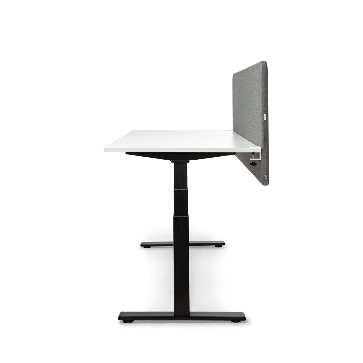 White height-adjustable desk with a grey MUTE acoustic screen, seen from the end