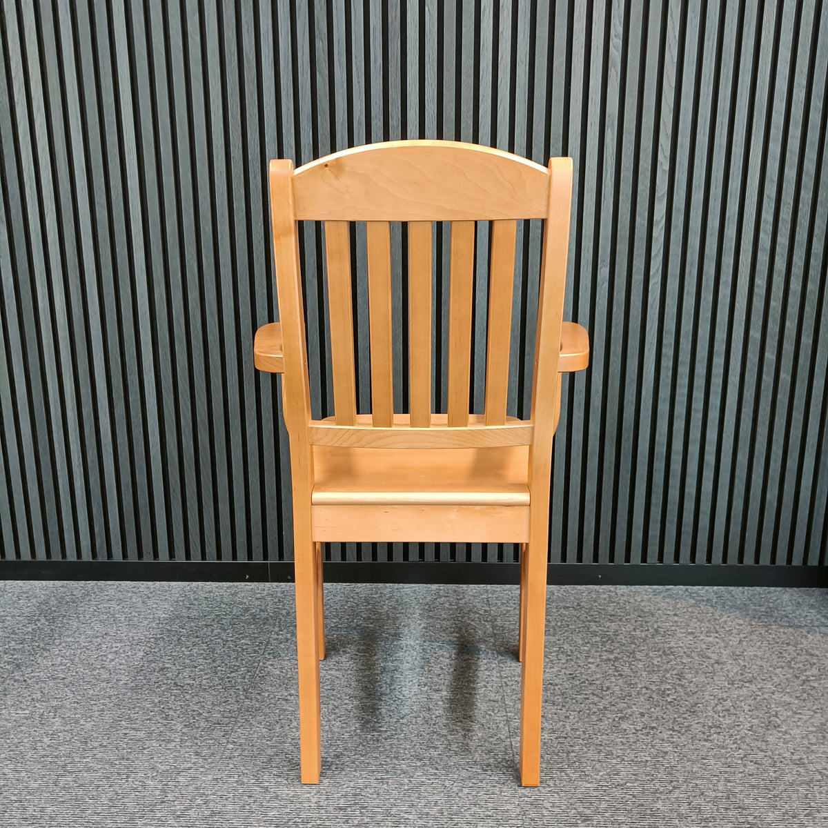 Petteri elevated wooden chair in beech viewed from the front