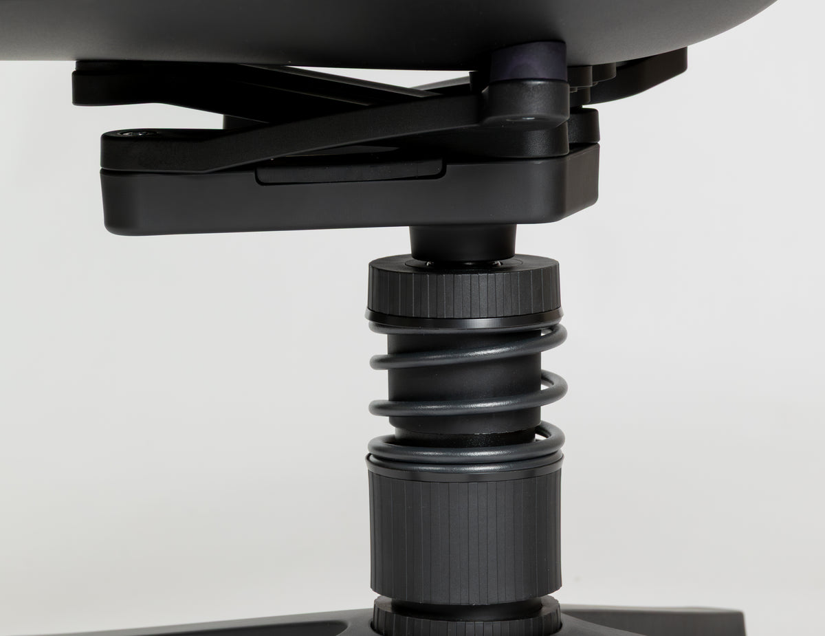 Close-up of the spring mechanism beneath the seat of a Linu Task chair