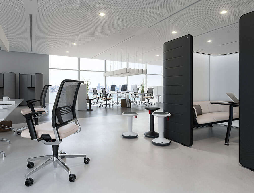 Bright office interior with a UPis1 Junior stool beside a task chair