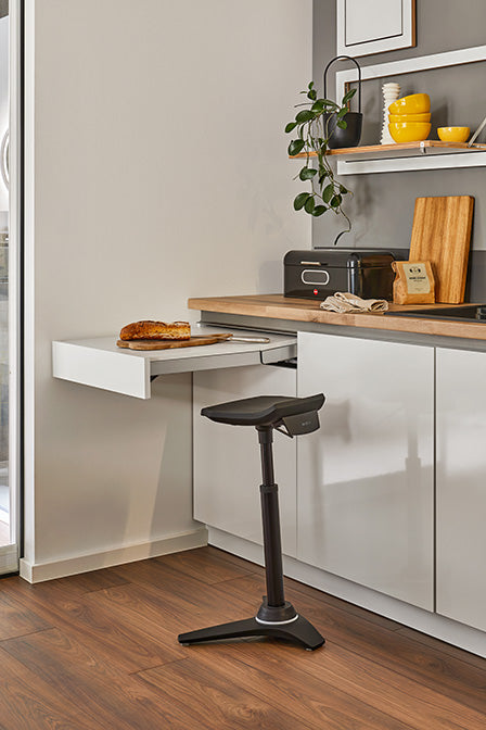 Black Muvman industry active stool beside a kitchen counter