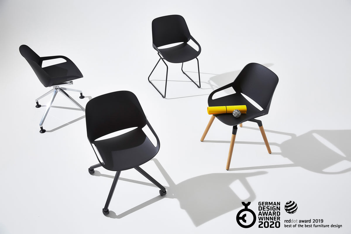 Three Numo active chairs in different base versions with a design award logo
