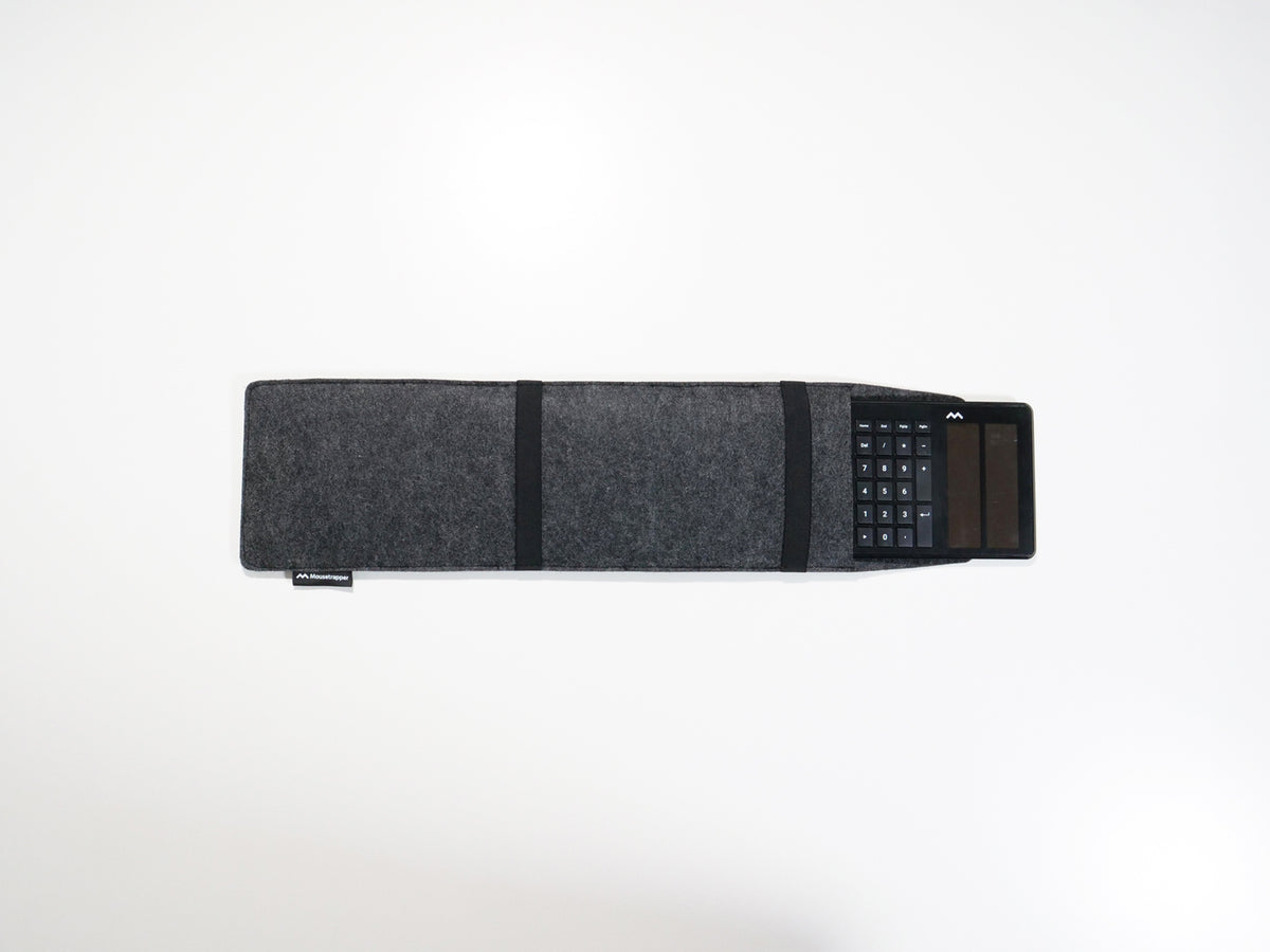 Grey felt laptop sleeve with the flap closed, seen at an angle