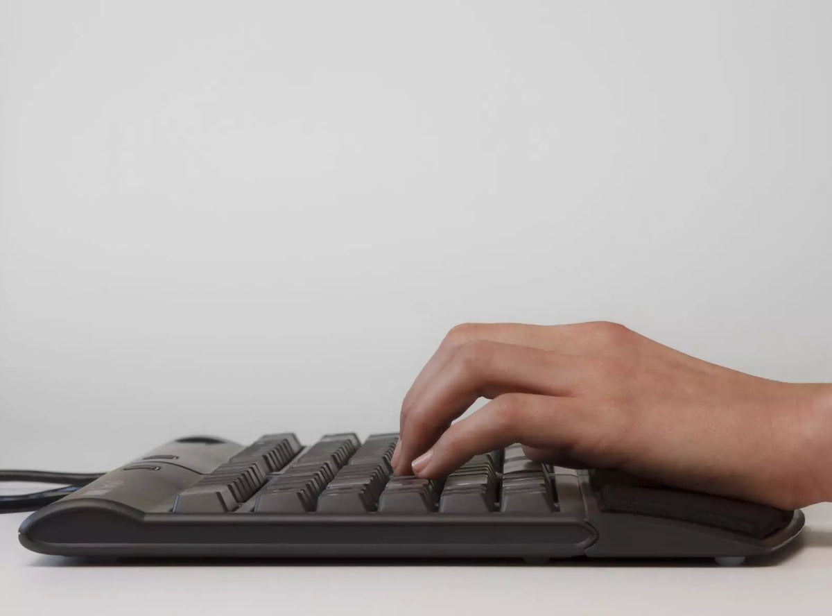 Hands typing on a Kinesis Freestyle 2 split keyboard