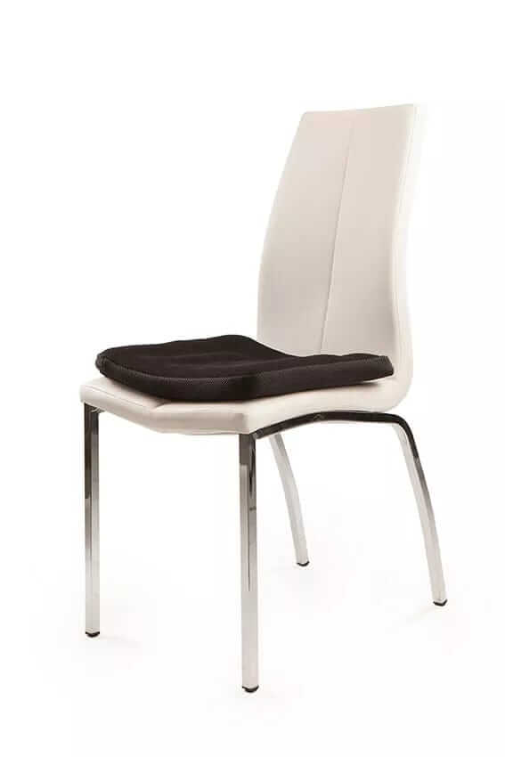 SitCell air cushion seat placed on a white dining chair